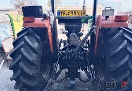 یک تراکتور ۲۸۵مدل۸۵.یک بارکش و یک گاو آهن.